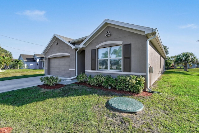 view of front of house featuring an attached garage, a front lawn, concrete driveway, and stucco siding