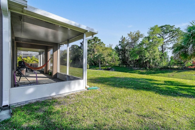 view of yard featuring a sunroom