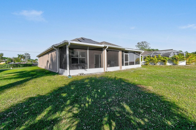 back of house with a yard