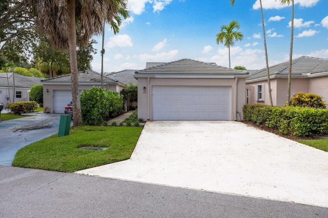 single story home featuring a garage