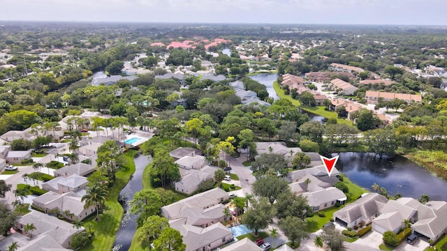 birds eye view of property with a residential view and a water view