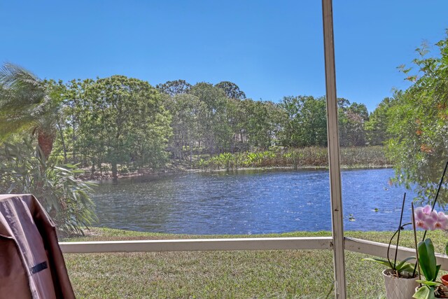 drone / aerial view with a residential view and a water view
