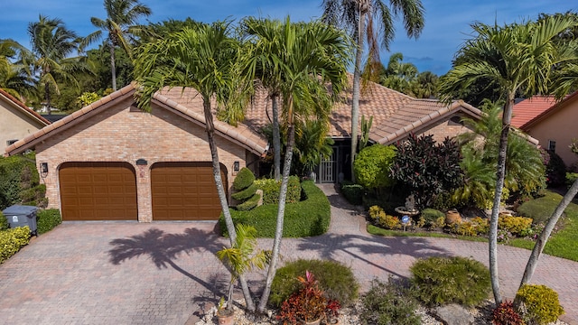 mediterranean / spanish house featuring a garage