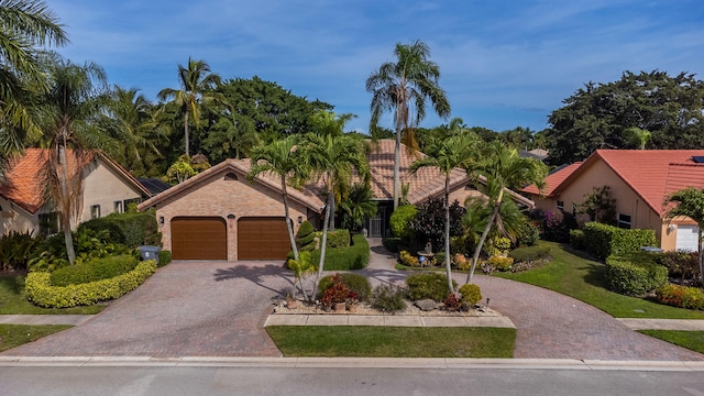 mediterranean / spanish-style home featuring a garage