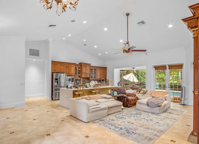 living room with crown molding, ceiling fan with notable chandelier, high vaulted ceiling, and french doors