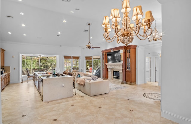 living room featuring a high ceiling, crown molding, and ceiling fan