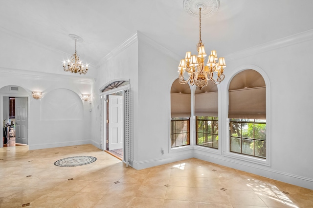 tiled entryway featuring crown molding and a chandelier