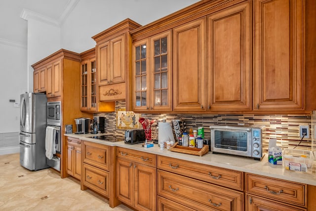 kitchen featuring light tile patterned flooring, ornamental molding, appliances with stainless steel finishes, and decorative backsplash