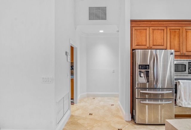 kitchen featuring appliances with stainless steel finishes and light tile patterned floors