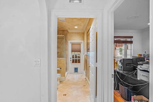 hallway with crown molding and light tile patterned flooring