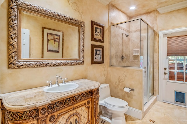 bathroom with an enclosed shower, vanity, and toilet