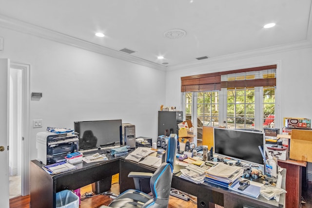 home office with ornamental molding and hardwood / wood-style floors