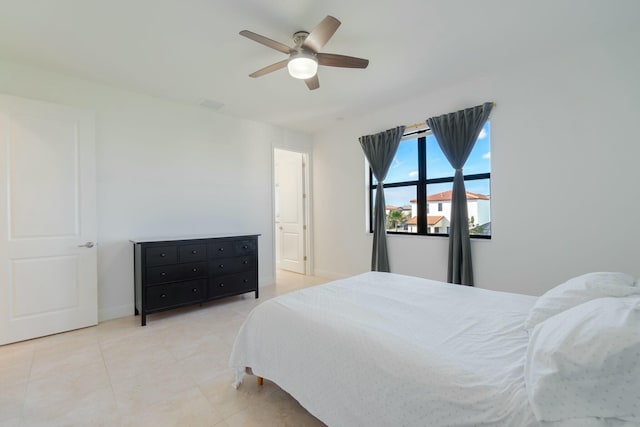 bedroom featuring light tile patterned floors and ceiling fan