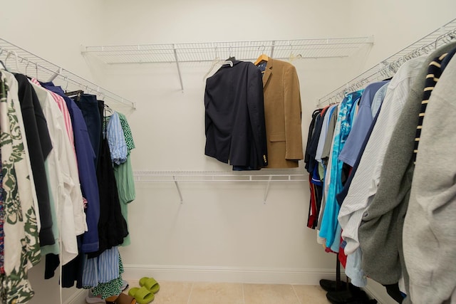 walk in closet featuring light tile patterned floors