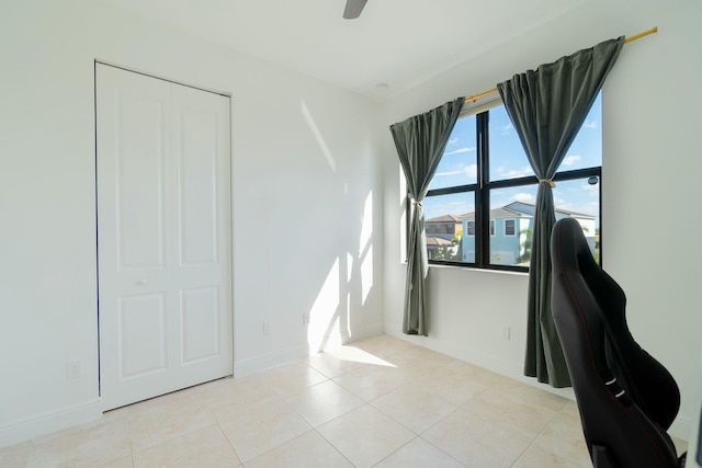 unfurnished office with light tile patterned floors