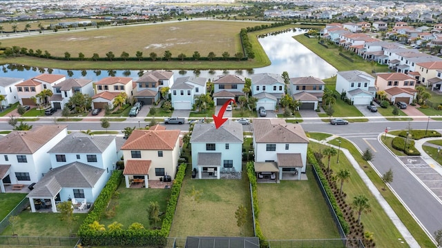 birds eye view of property featuring a water view