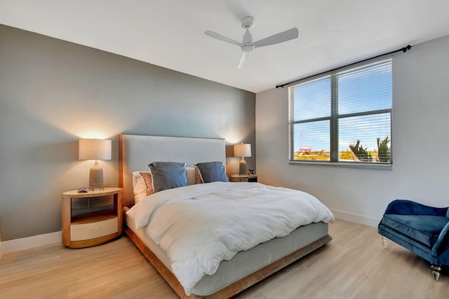 bedroom featuring light wood-type flooring and ceiling fan