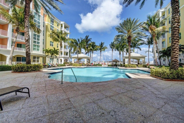 view of pool with a patio and a gazebo