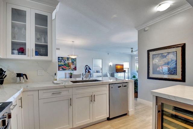 kitchen with white cabinetry, appliances with stainless steel finishes, sink, and wine cooler