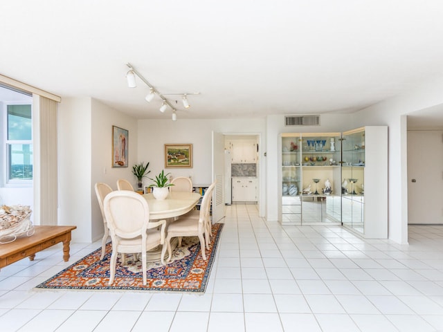 dining area with light tile patterned flooring