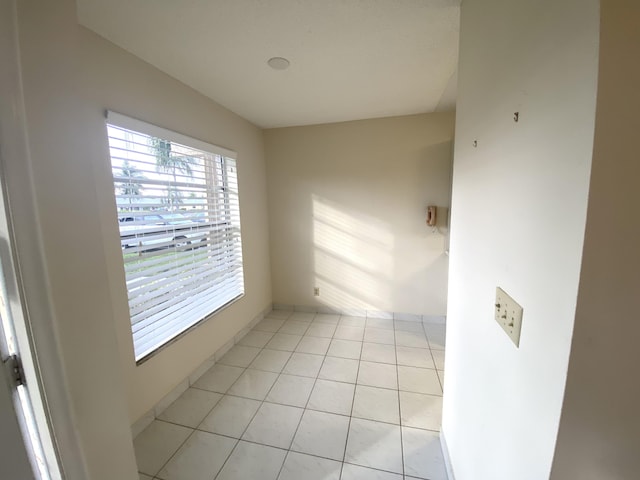 unfurnished room with light tile patterned floors