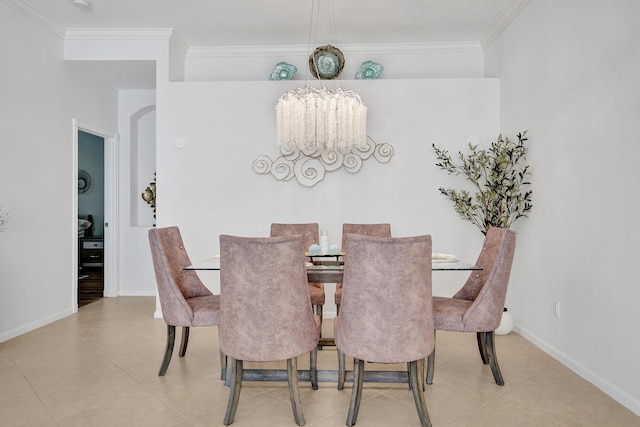 tiled dining space with an inviting chandelier and crown molding