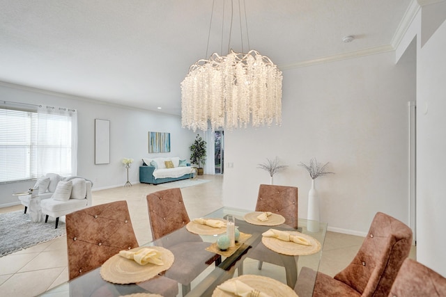 dining area featuring ornamental molding, light tile patterned floors, and an inviting chandelier