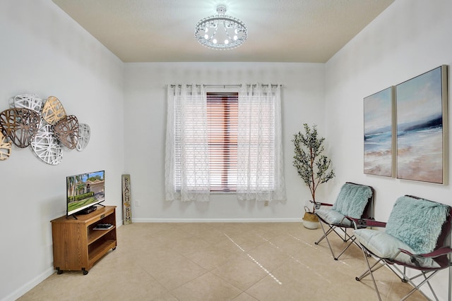 sitting room with an inviting chandelier