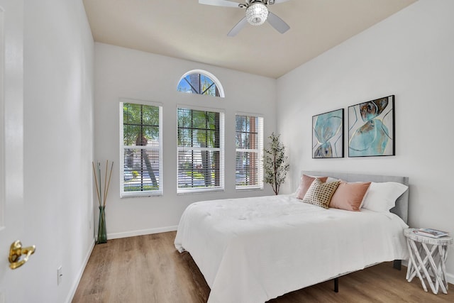 bedroom with ceiling fan and hardwood / wood-style floors