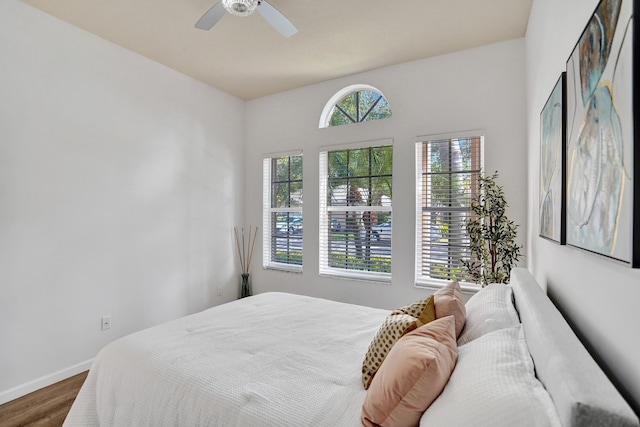 bedroom featuring ceiling fan and hardwood / wood-style floors