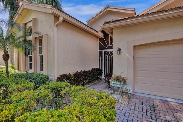 doorway to property featuring a garage