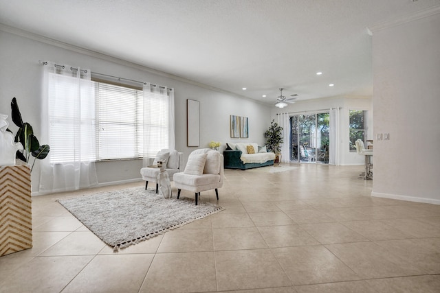 living room featuring ornamental molding, a healthy amount of sunlight, and light tile patterned floors