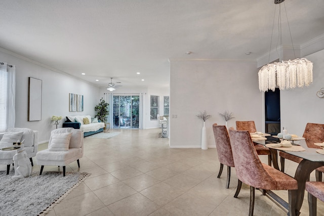 tiled dining area featuring ornamental molding and ceiling fan