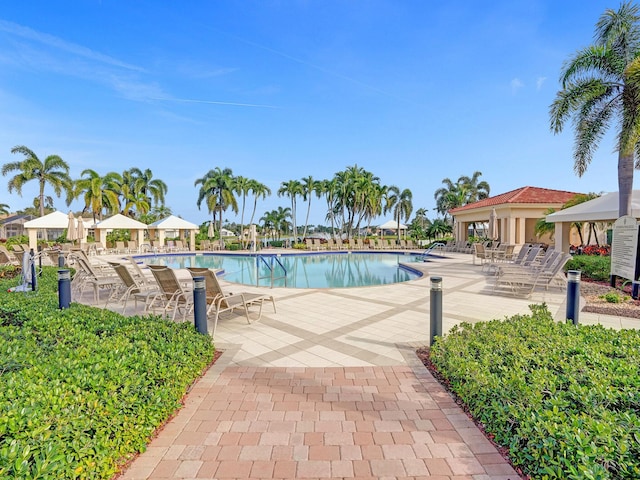 view of swimming pool with a gazebo and a patio area