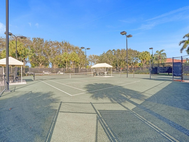 view of tennis court featuring a gazebo