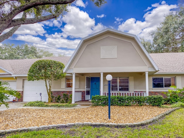 view of front of home with a garage and covered porch