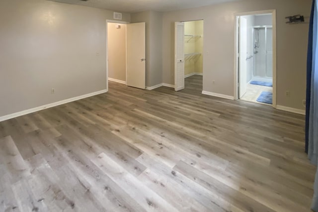 spare room featuring wood-type flooring