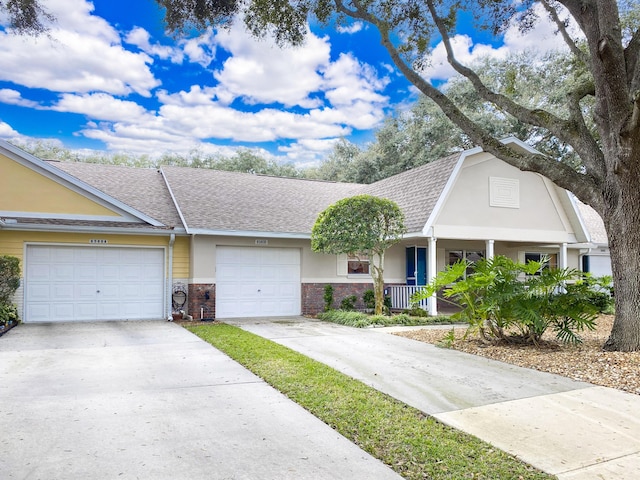 ranch-style home featuring a garage and covered porch