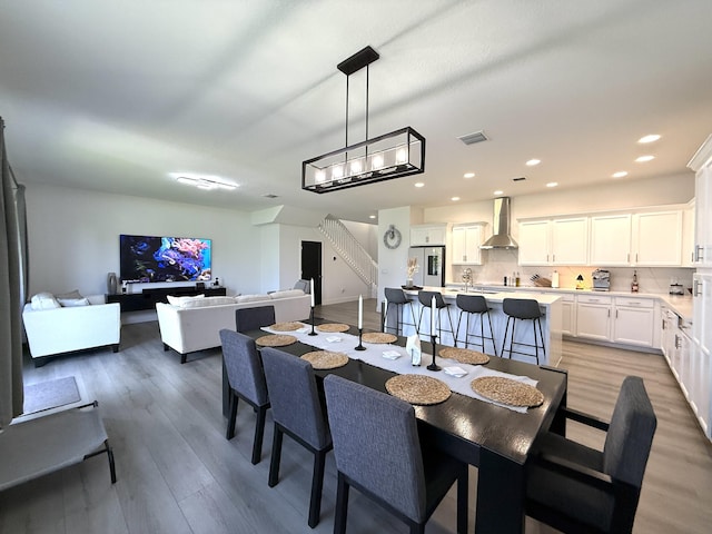 dining area with wood-type flooring