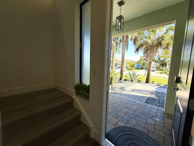 doorway to outside with wood-type flooring