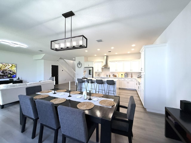 dining room featuring a chandelier and light wood-type flooring