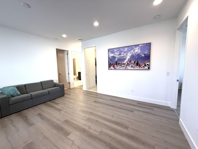 unfurnished living room featuring light hardwood / wood-style floors