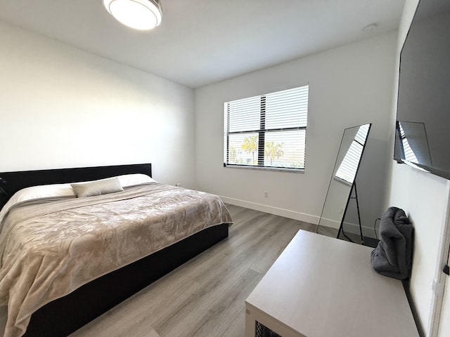 bedroom with light hardwood / wood-style flooring