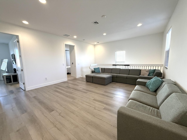 living room with light hardwood / wood-style flooring