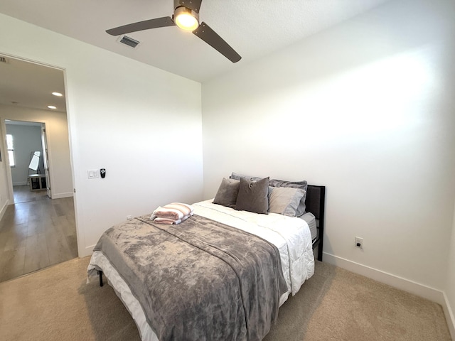 bedroom with ceiling fan and carpet