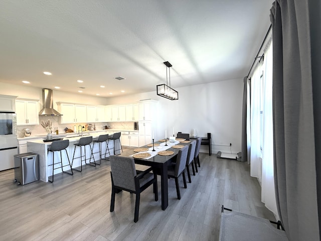 dining area with light wood-type flooring