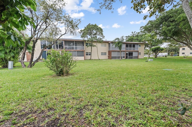 view of yard with a sunroom