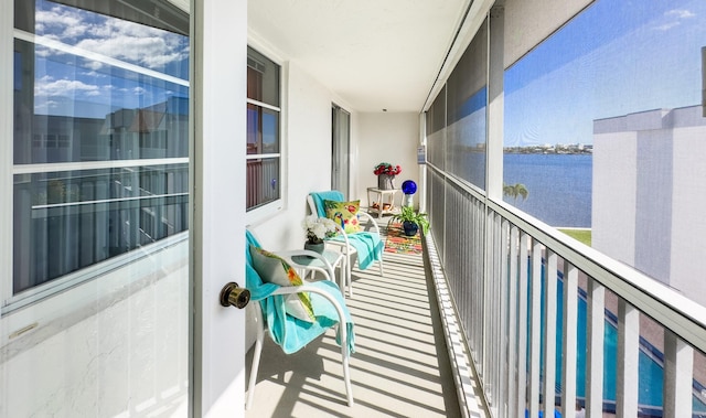 balcony featuring a water view