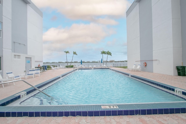 view of swimming pool featuring a patio