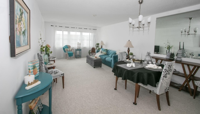 dining area with a chandelier and carpet flooring